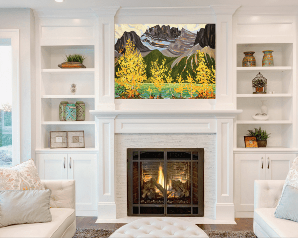 Landscape Painting above fireplace. Title: Rockies in Fall, Original Oil 36x48 by Canadian artist Dennis Brown.