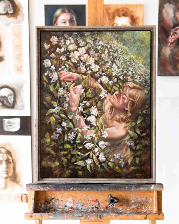 "Veiled Touch" by Ananda Dhama – 24x18 inch oil on canvas of a serene female figure immersed in white blossoms and green foliage, painted in natural light.