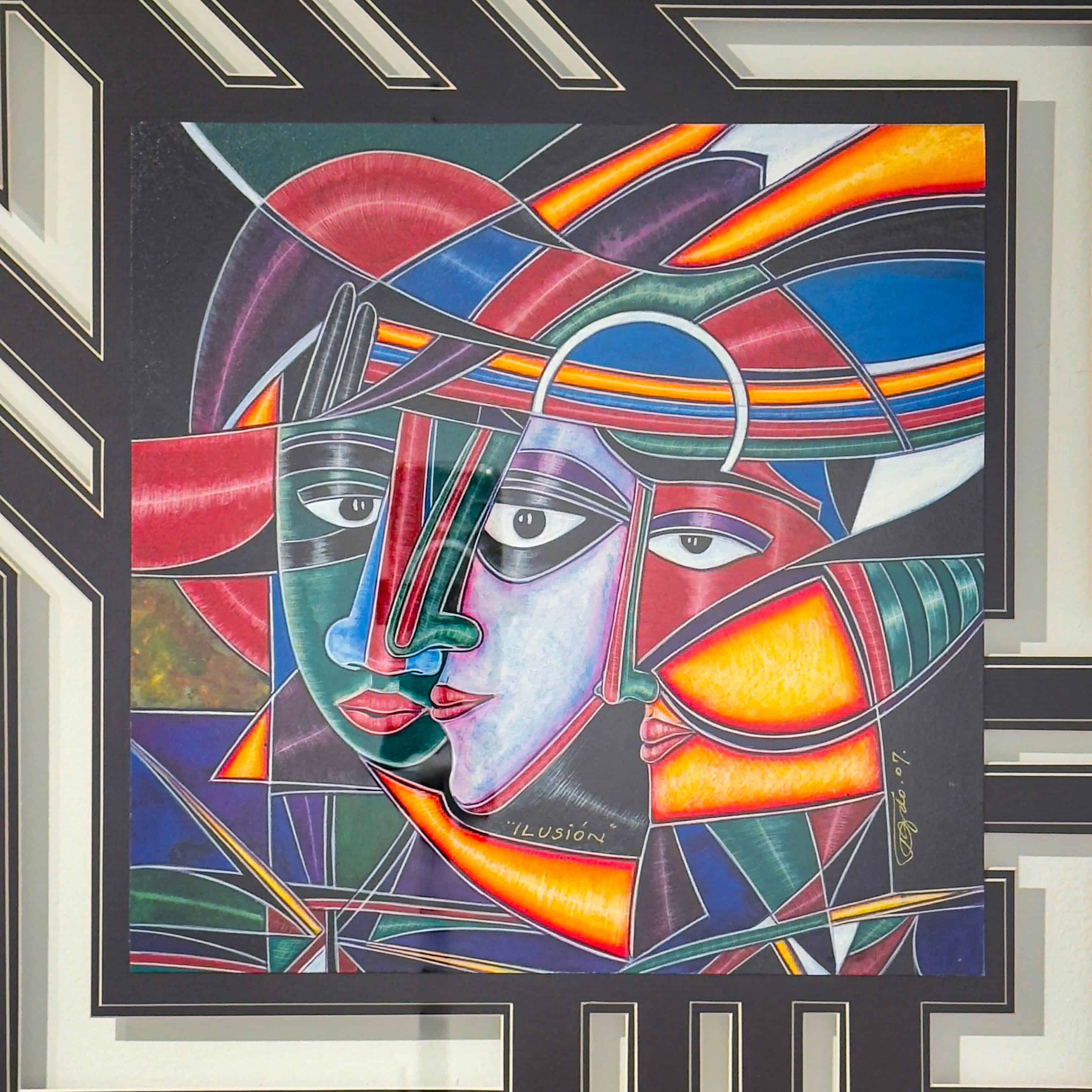 Ilusion by Juan Quevedo — colorful cubist watercolor of overlapping faces with geometric forms and expressive lines in red, blue, and orange hues.