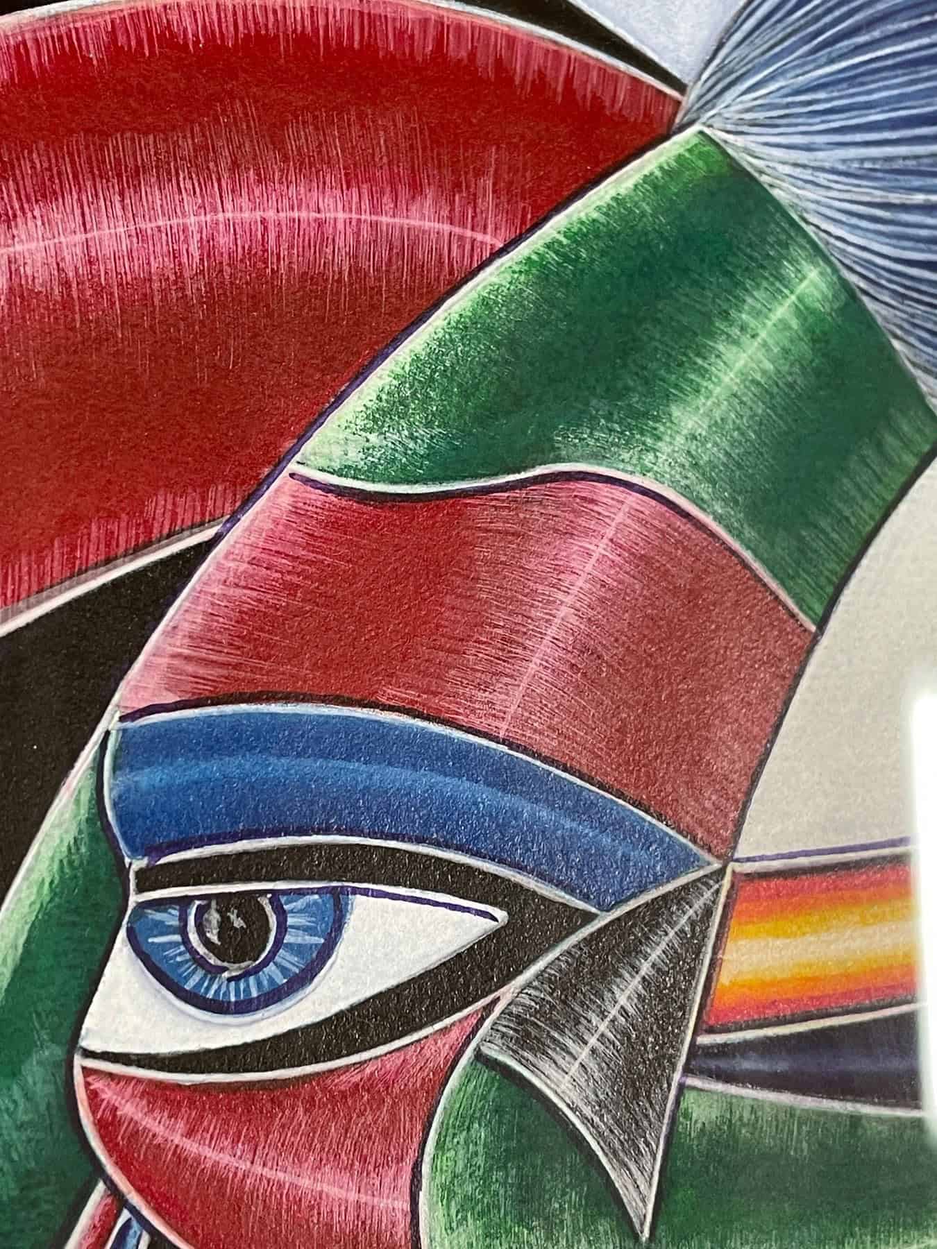 Framed multi-media artwork “Memorias” by Juan Quevedo featuring a colorful geometric abstract portrait.