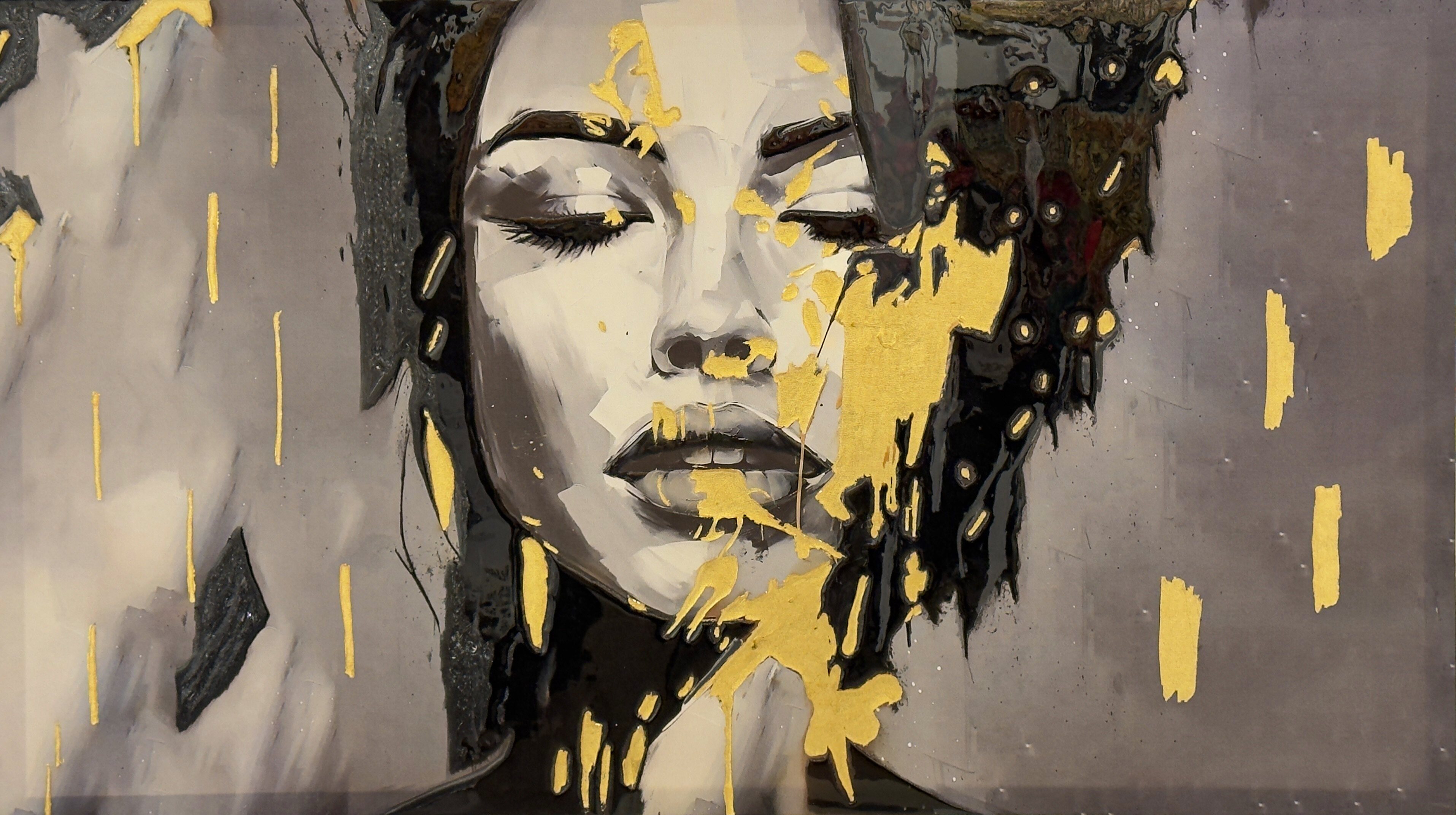 Ash and Gold by Selva Azad, a mixed media and resin portrait featuring a monochrome face accented with fractured gold textures and layered surfaces.